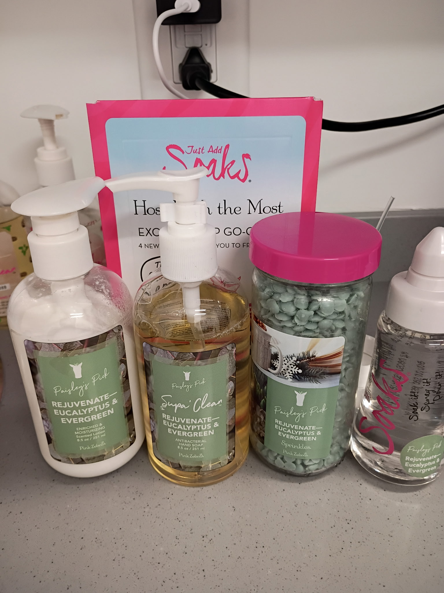 Pump bottles of lotion and a jar on the counter